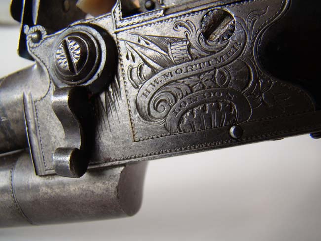 An 18th century double barreled flintlock pocket pistol signed "H.W. Mortimer, Gun Maker to His Majesty" circa 1790. — image 3